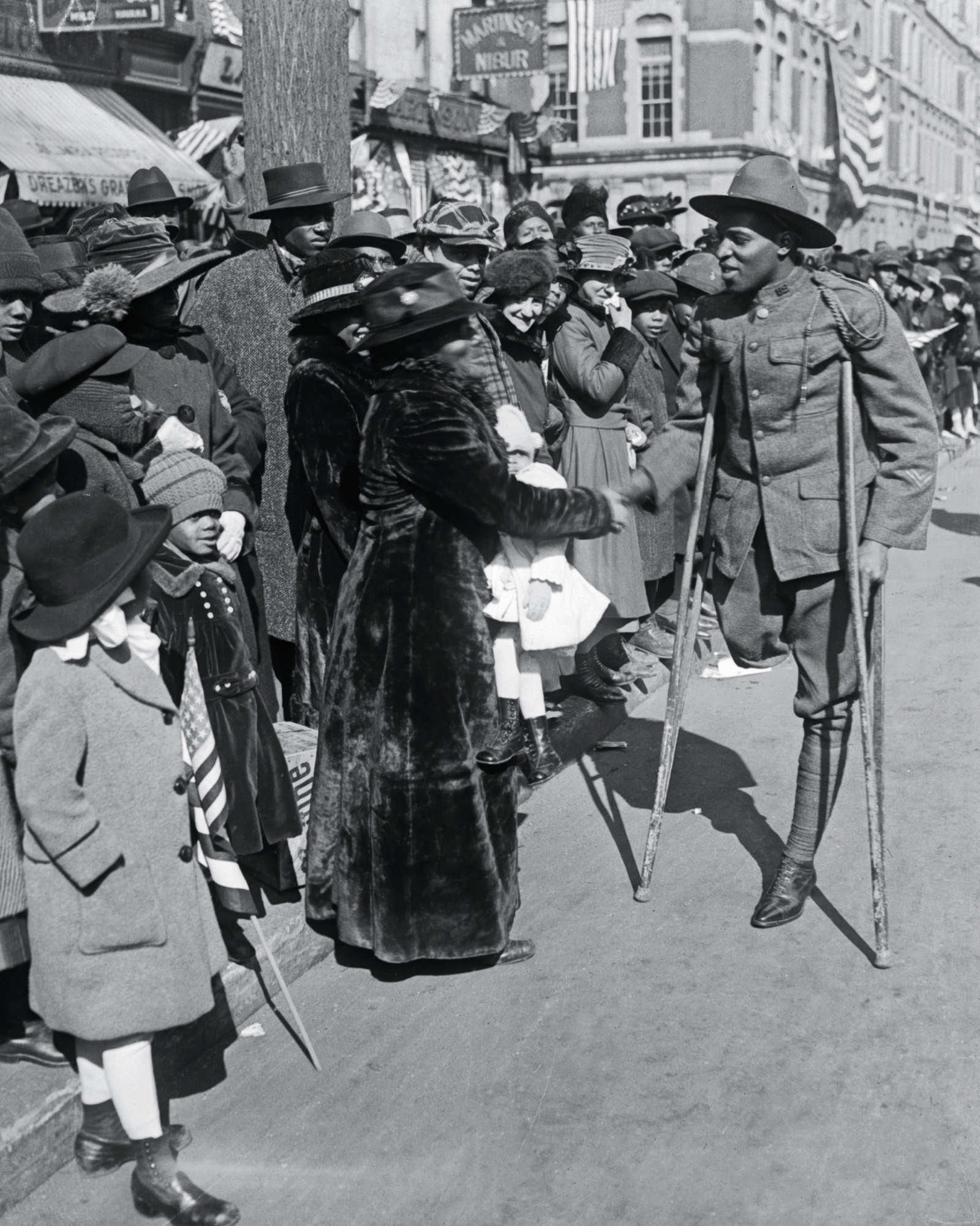 A wounded soldier of the 369th Infantry known as the Harlem Hellfighters is - photo 5