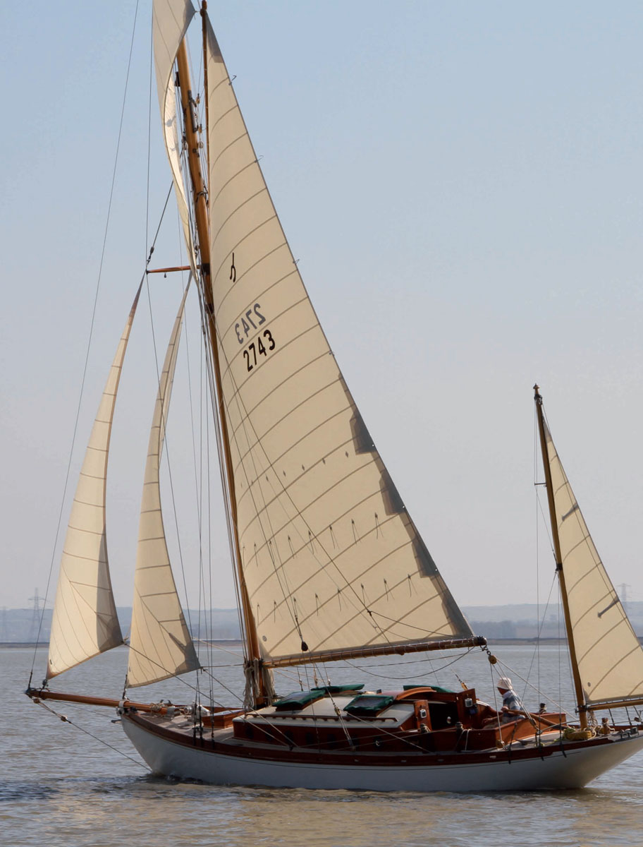 A gaff cutter yawl being sailed single-handedly This book is very different - photo 5