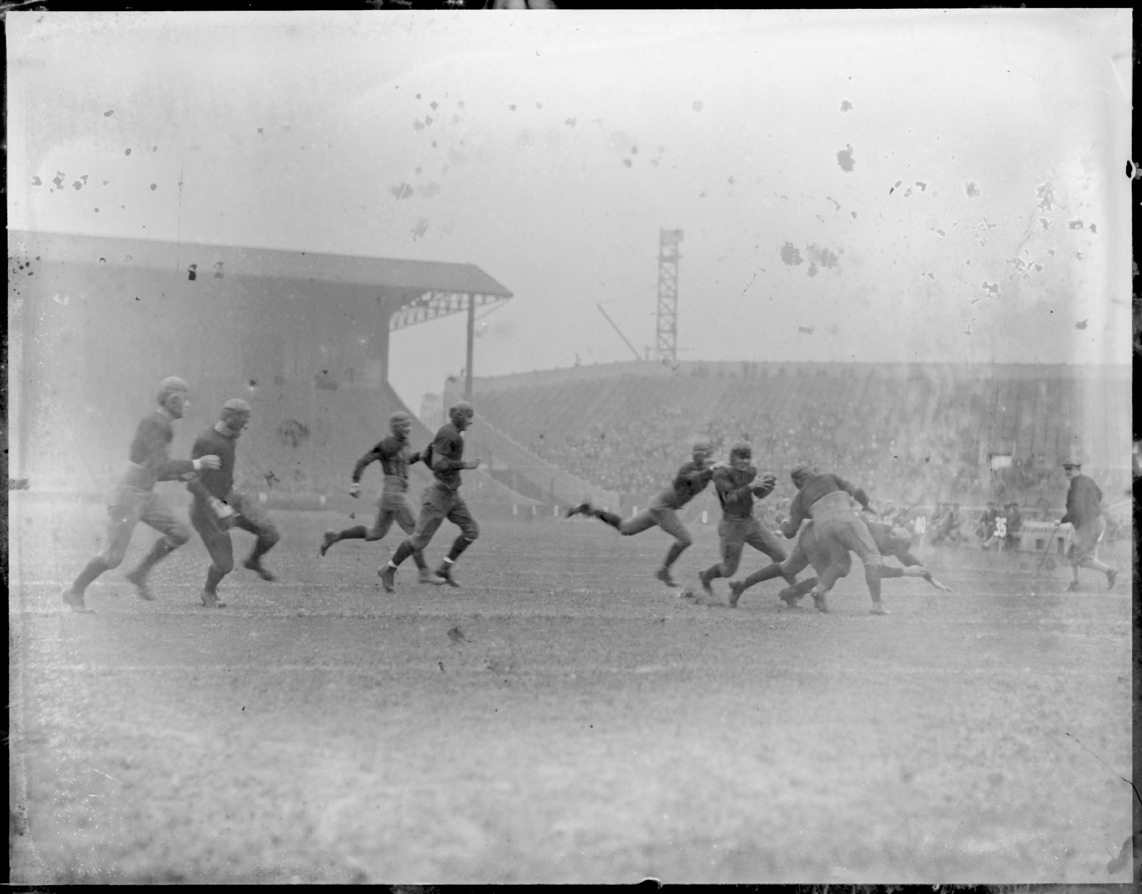 This early photograph of football at Braves Field in Boston captures the gritty - photo 2