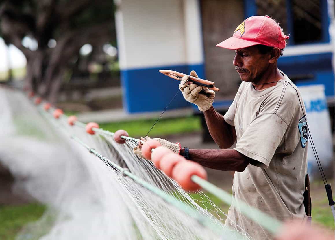 Fisherman mending his net Puntarenas Corrie WingateApa Publications - photo 12