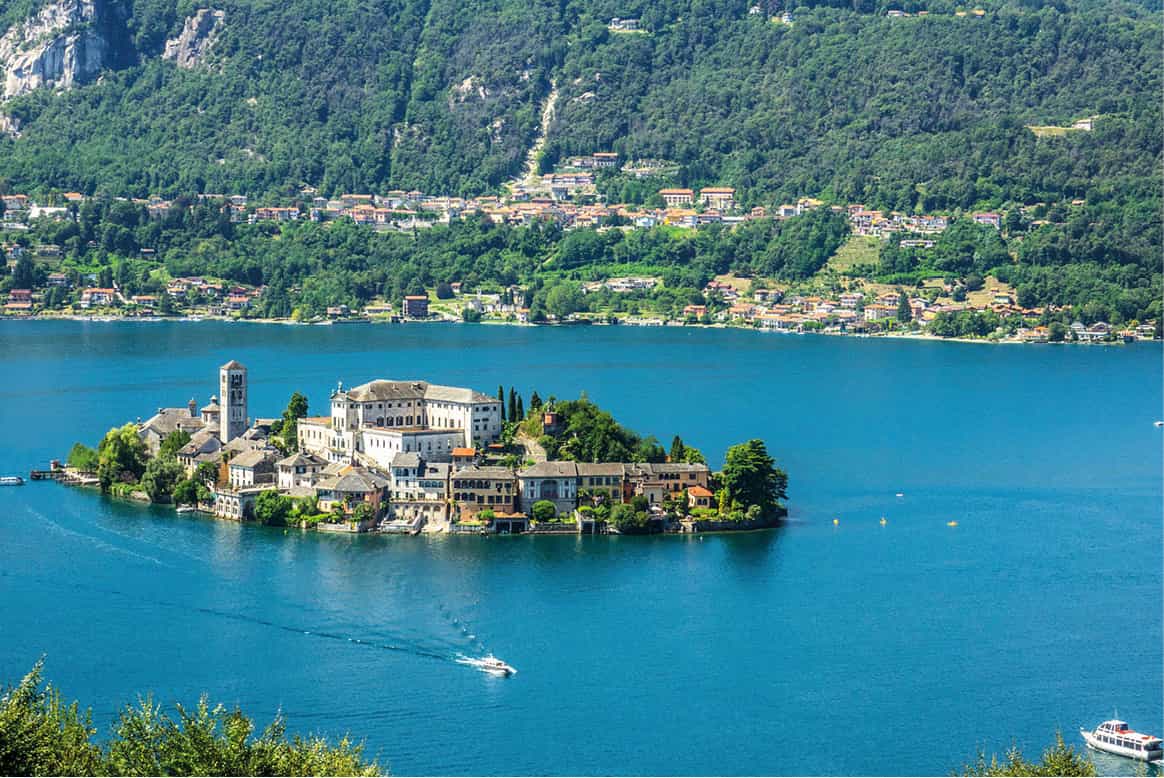 Orta San Giulio A legendary island brightly painted fishing boats and - photo 12