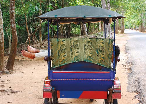 tuk-tuk brass deities and animals for sale Khmer girl looking at - photo 11