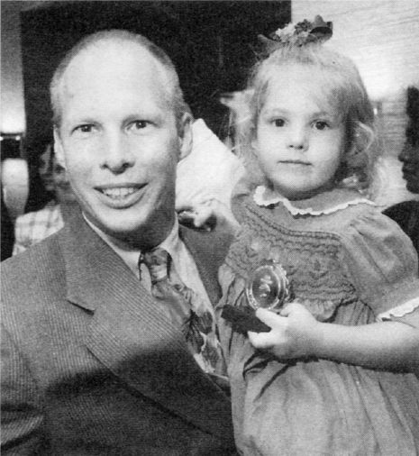 FedEx engineer ANDY PETERSON holds his four-year-old daughter Anna after the - photo 2