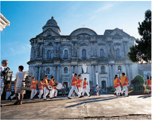 Civic parade passing the heavyset Basilica of Taal Batangas Surfboards - photo 7