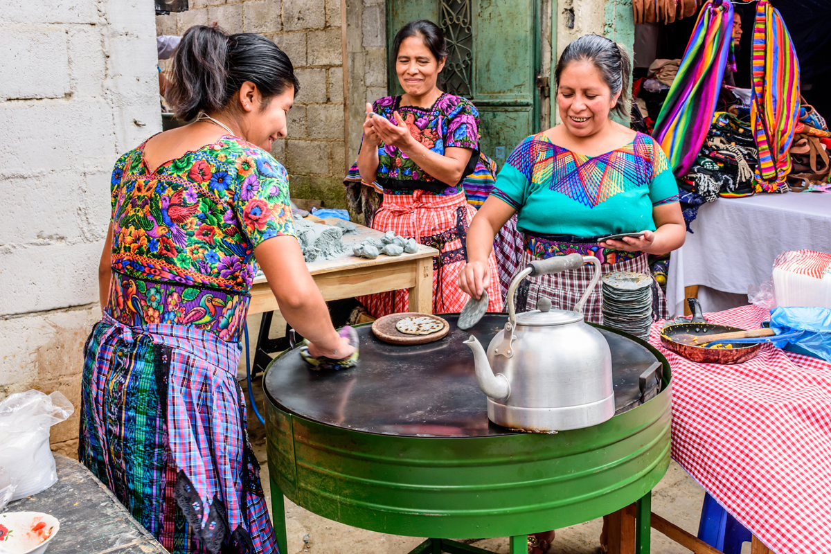 iStock WOMEN MAKING CORN TORTILLAS FOR A FESTIVAL Guatemala is still a - photo 5