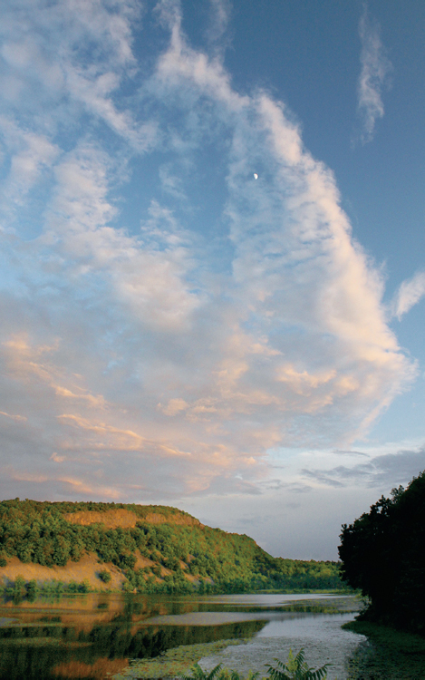 Sunset lights up the cliffs of Beseck Mountain at Black Pond State Fishing - photo 6