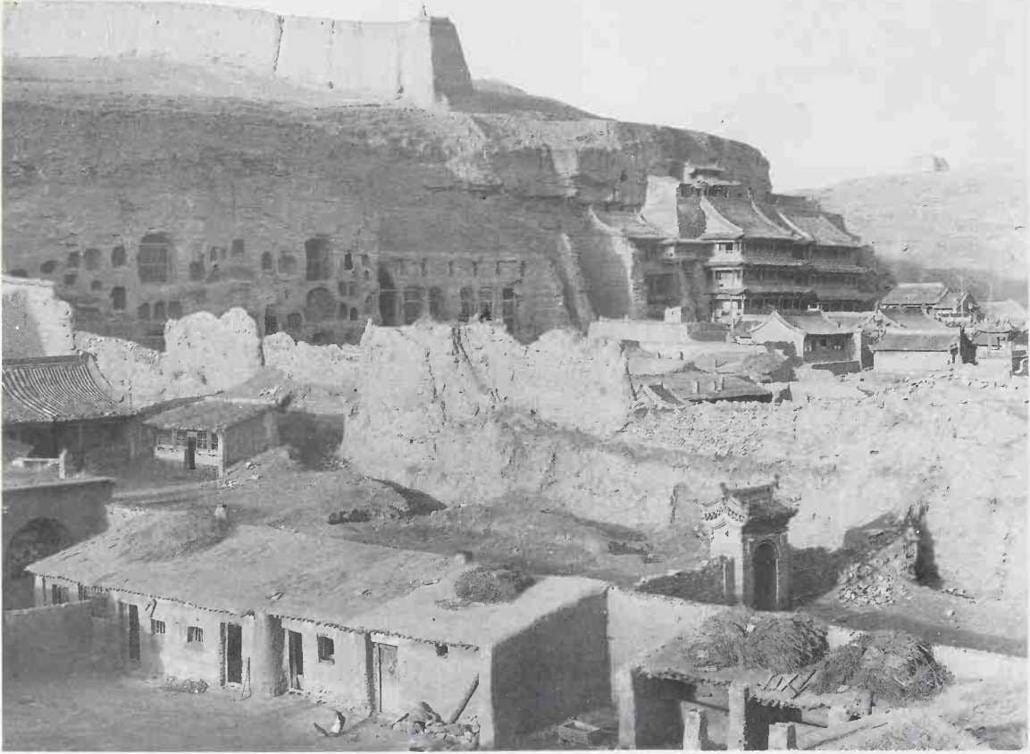 The cliff face housing the caves Temple built against the cliff face - photo 5