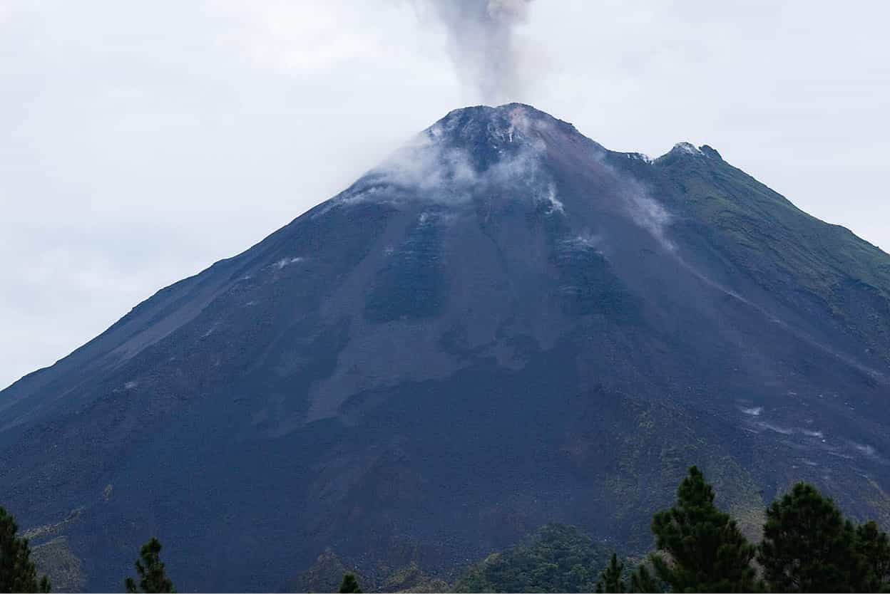 Arenal Volcano Picture-perfect cone-shaped Arenal stands out as the countrys - photo 13