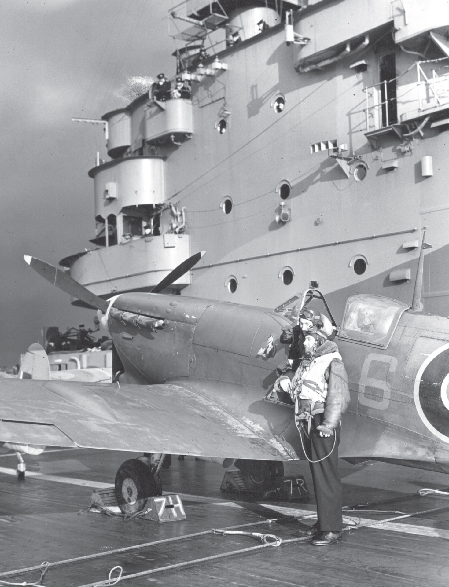 Two 899 NAS pilots pose by a Seafire IIC for a press photo call on Indomitable - photo 2