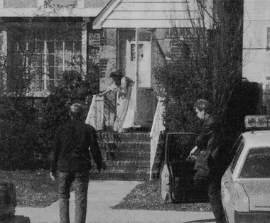 Kathleen Farley on the steps of her neighbors home as police arrive Photo - photo 2