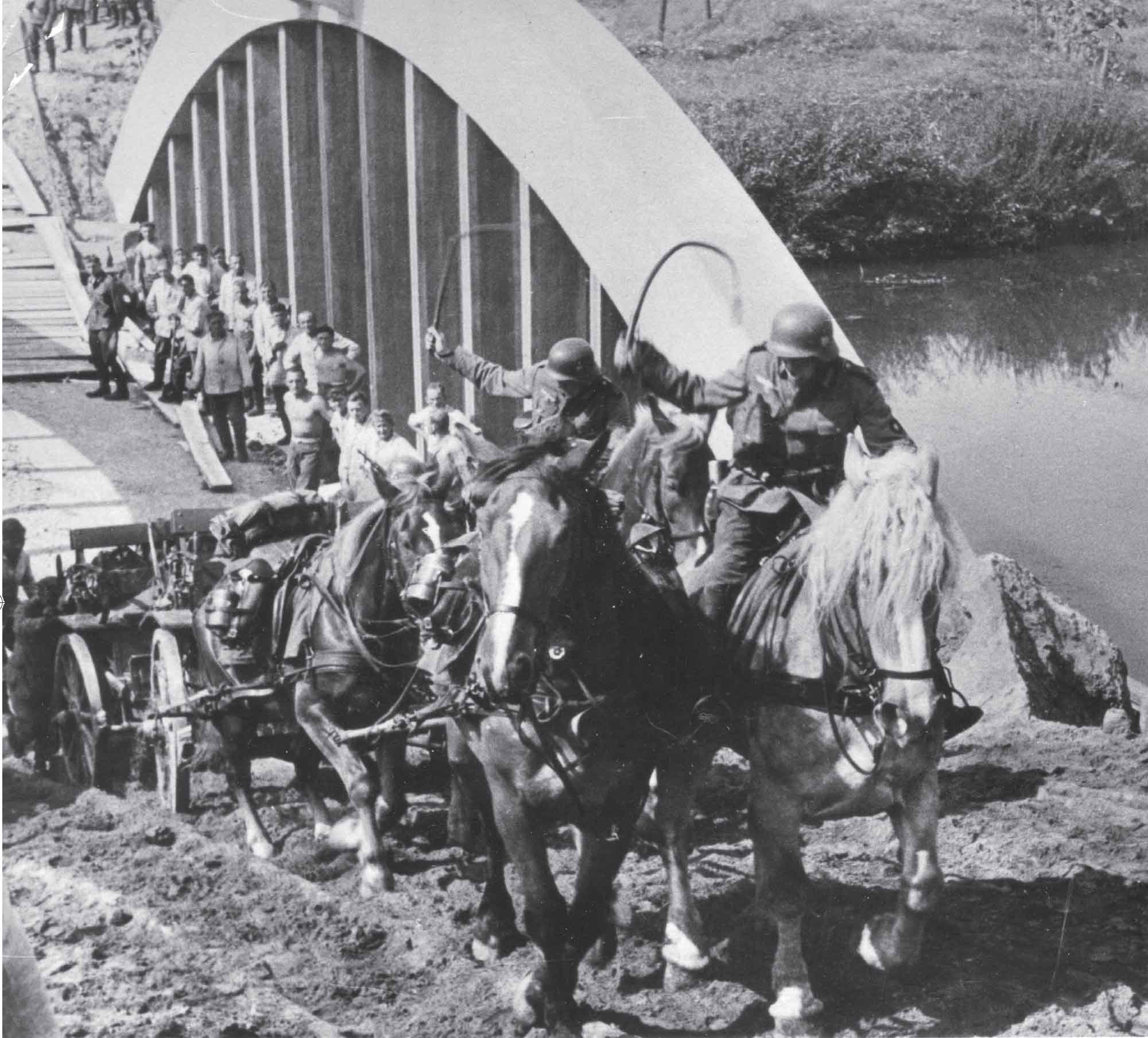 Blitzkrieg in Poland German horse-drawn artillery struggles up a riverbank - photo 4