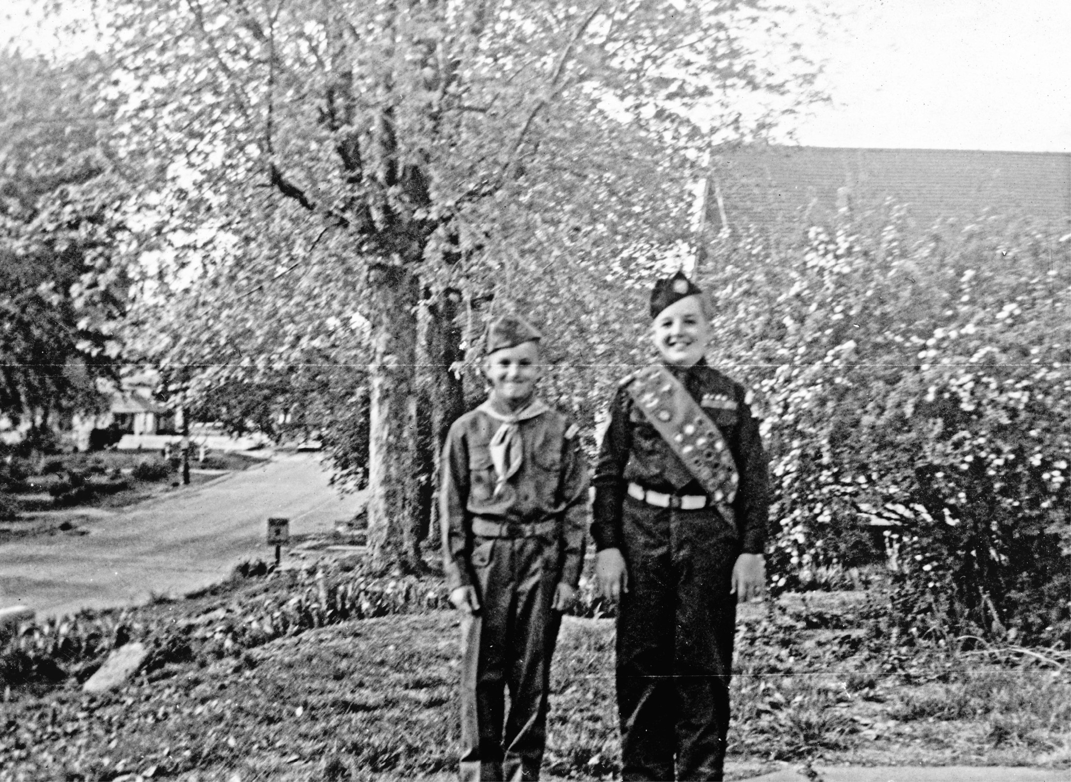 Me in my Boy Scout uniform next to my brother Butch in front of my home in - photo 3