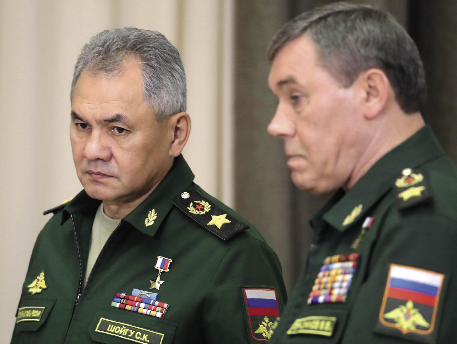 Russian Defense Minister Sergei Shoigu left confers with his Chief of the - photo 6