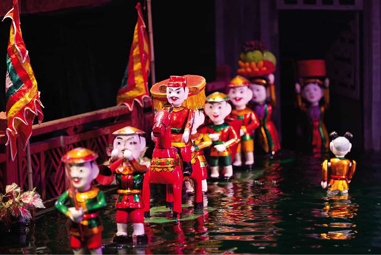 Top Attraction 10 Shutterstock Water puppetry An art form unique to Vietnam - photo 13