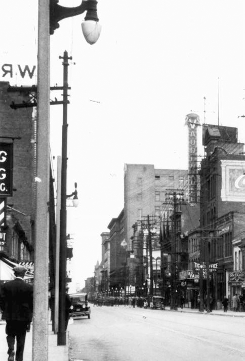 A row of rather seedy enterprises pawnshops cigar stores printers a caf and - photo 2