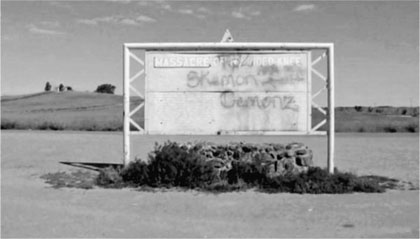 Figure P1 Graffitied and vandalized sign titled Massacre of Wounded Knee - photo 3