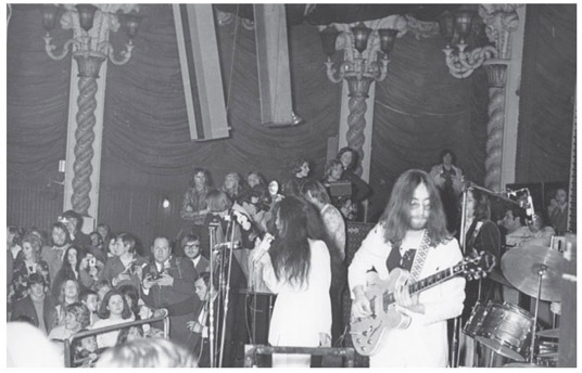 John Lennon and Yoko Ono at the Lyceum Ballroom in London December 16 1969 - photo 14