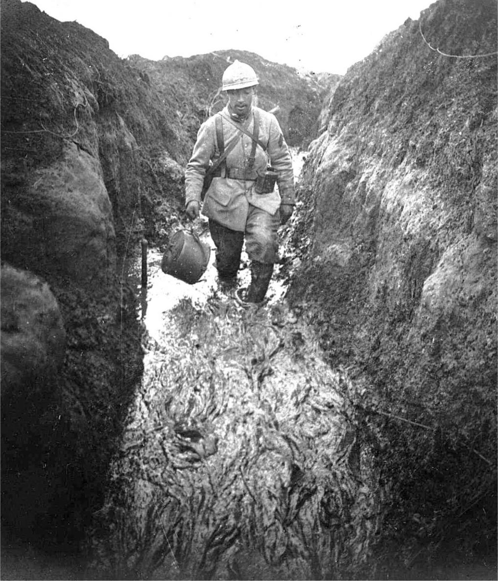 Calf deep in mud a signaller struggles to lay a line down a waterlogged - photo 1