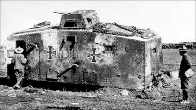 A disabled and abandoned A7V being examined by New Zealand soldiers The - photo 4