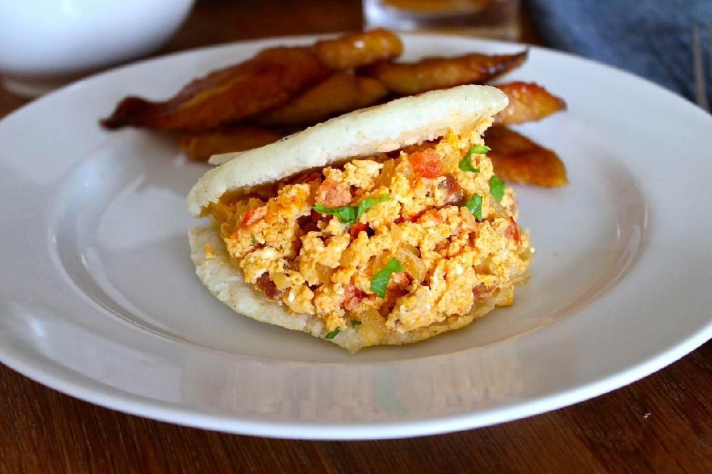 This is such a popular Colombian breakfast dish made with arepa pieces and - photo 7