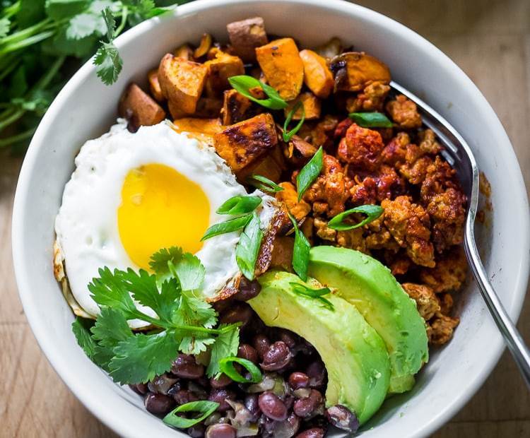 This easy to make breakfast bowl is filled with potato puffs vegetables eggs - photo 9