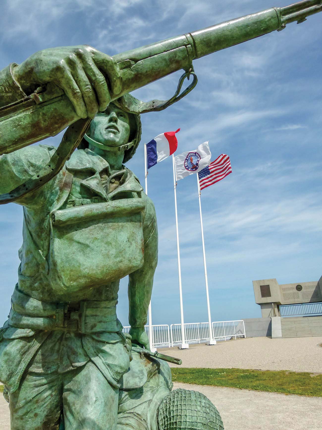 a statue immortalizing a US GI on Omaha Beach morning seafood market with - photo 5