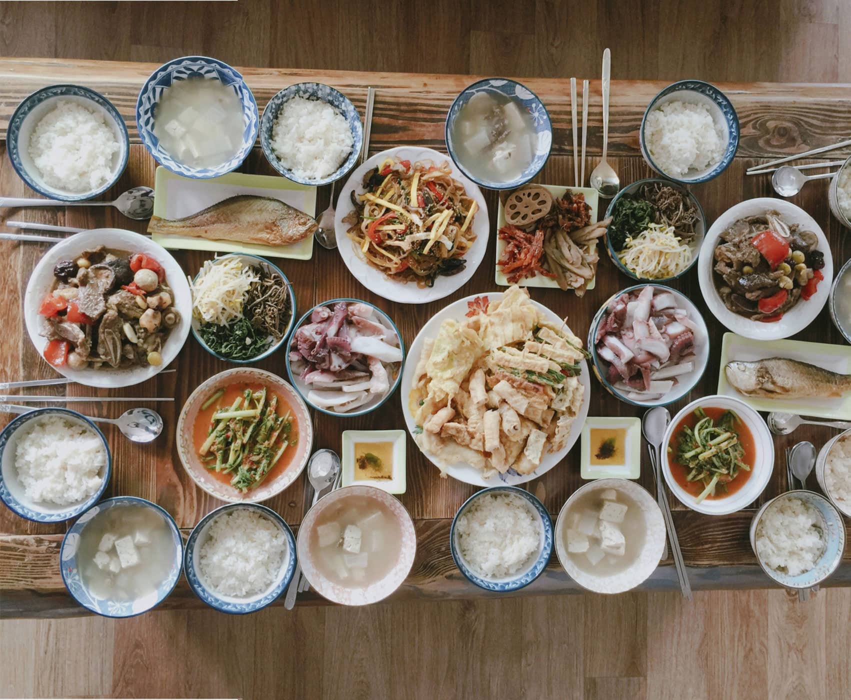 A table filled with a variety of Korean food A Brief History The early - photo 6