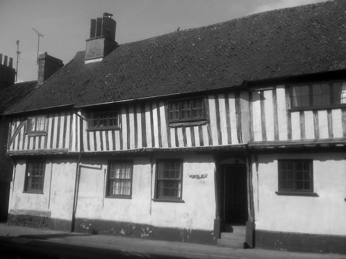 Medieval timbered building Bury St Edmunds Model of wolf guarding King - photo 8