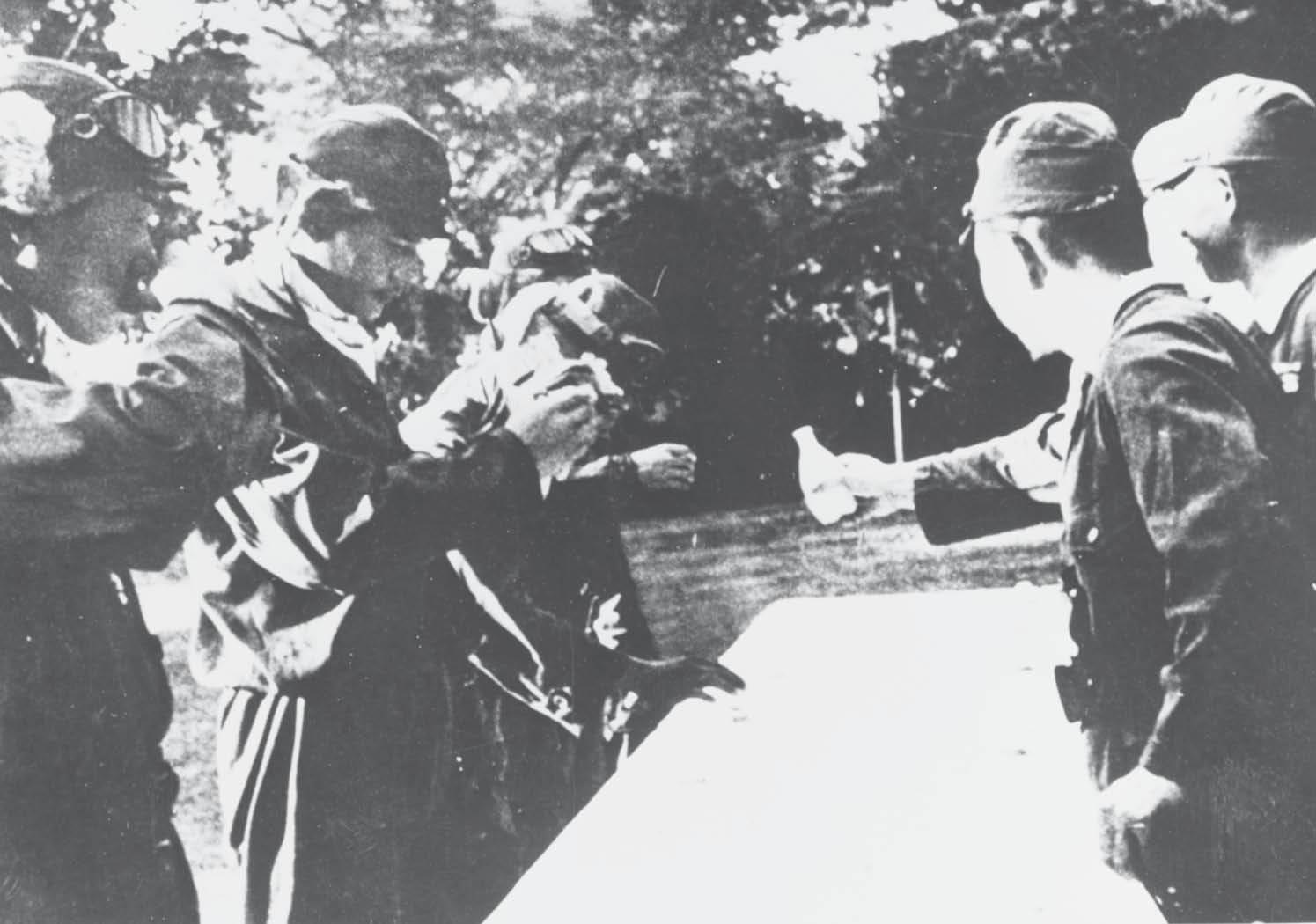 One of the first group of kamikaze special attack pilots share a ceremonial cup - photo 4