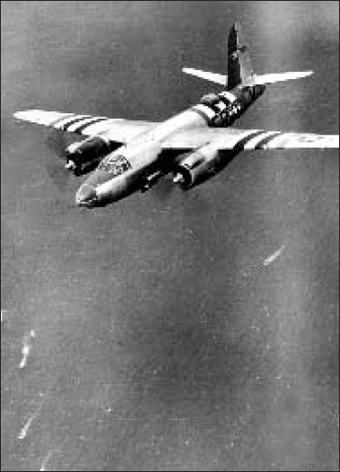 A USAAF B-26 Marauder medium bomber in distinctive D-Day stripes over the - photo 5