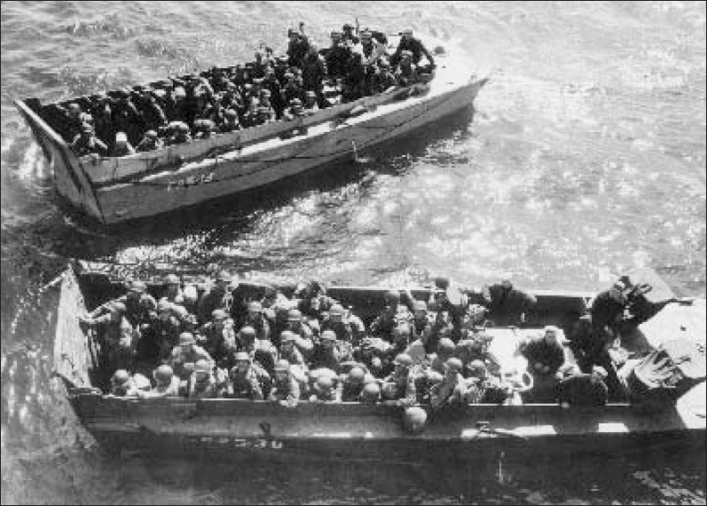 US soldiers packed into Higgins Boats or LCVPs prepared to move off from a - photo 6