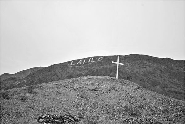 The cross on top of the Calico Cemetery is silhouetted against King Mountain - photo 5