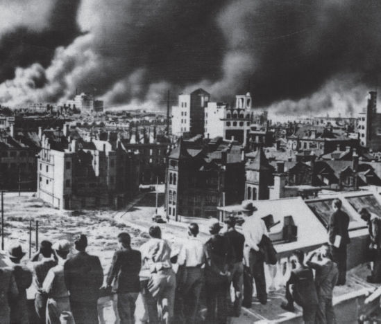 Westerners watch the fighting in Shanghai from a rooftop in the International - photo 6