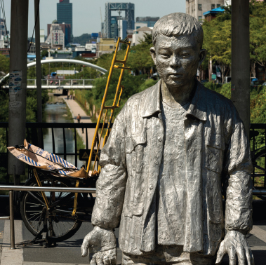 10 Statue of Jeon Tae-il on a bridge in Seoul Jeon was a garment worker whose - photo 12