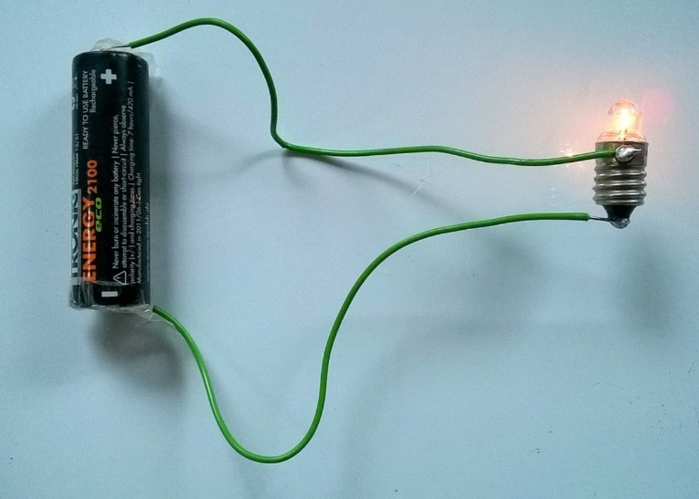 A basic circuit with an AA battery and a light bulb The voltage source for - photo 2