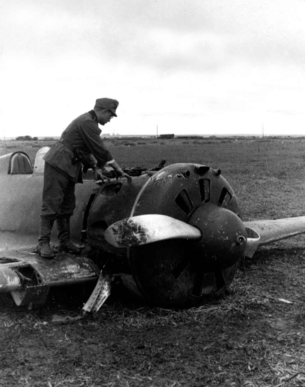 This Soviet wheels-up I-16 fighter its propeller blades all bent out of shape - photo 1