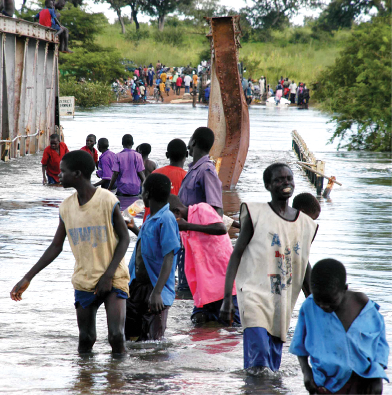 These boys waded through the overflowing Achwra River in Uganda after the - photo 4