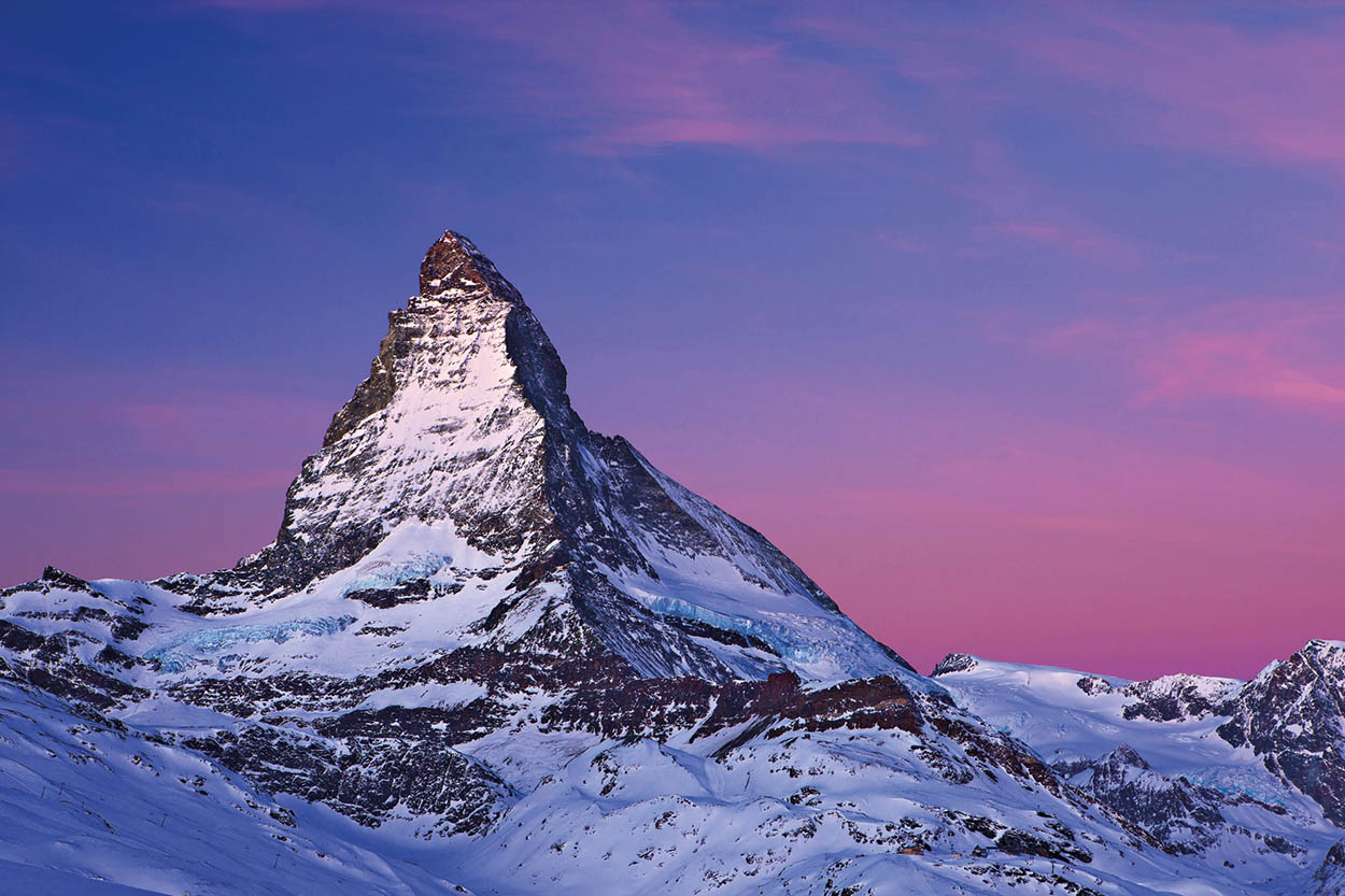 The Matterhorn Switzerlands iconic pyramidal peak towers above the resorts of - photo 4