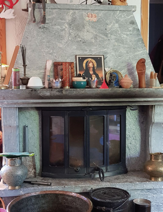 The fireplace of our living room opposite which I meditate TRAVELS ON THE - photo 3