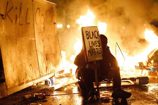 Protester rests during a November 2014 demonstration in Oakland California - photo 3