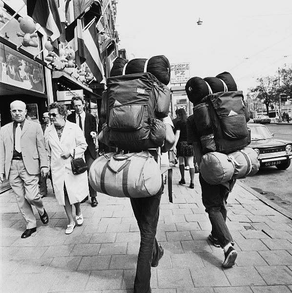 Backpackers walking toward Central Station Amsterdam May 1973 Photograph by - photo 4