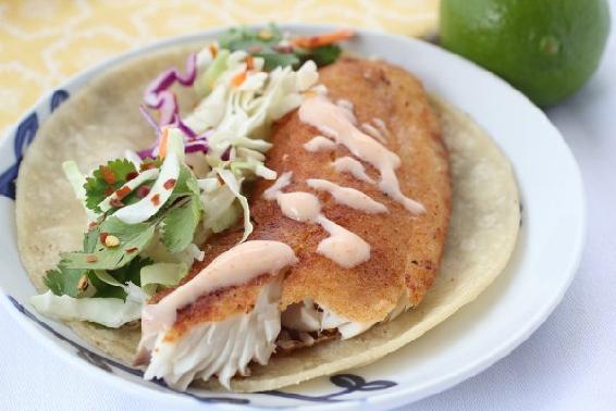 These delicious fish tacos are wrapped in a warm tortilla and topped off with - photo 6