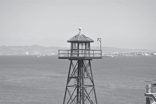 The iconic Alcatraz guard tower overlooking San Francisco Bay and the city - photo 4