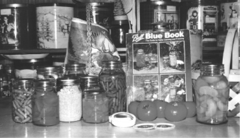 Home canning helps fill the pantry Note decorative popcorn tins in the - photo 1