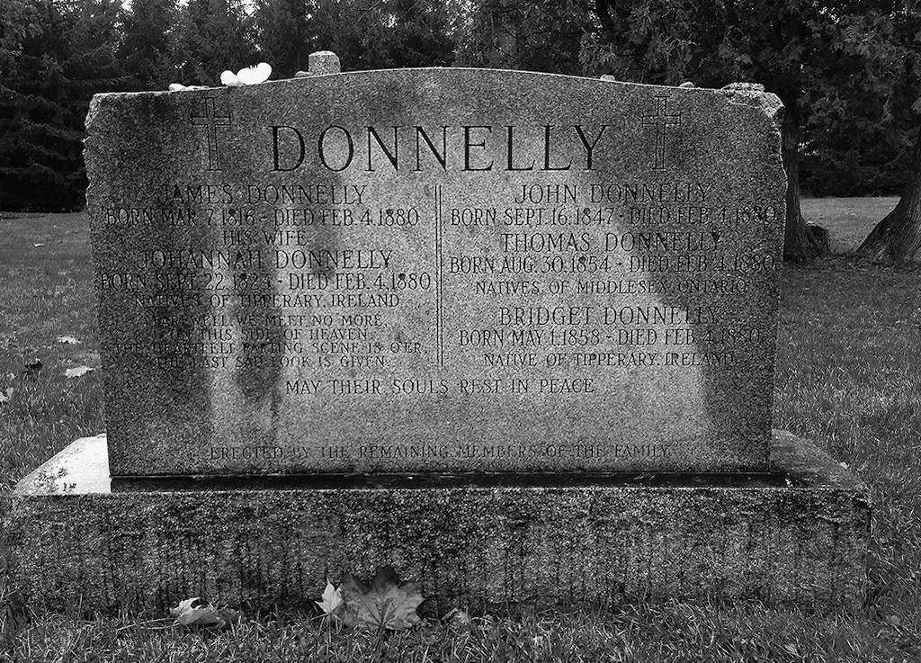 The Donnelly family headstone indicating the family members who were murdered - photo 5