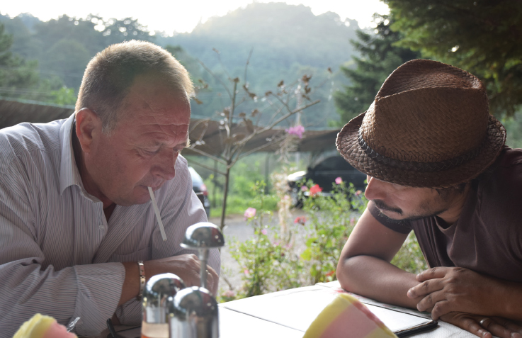 Idar and Tharik examine the menu at the restaurant in the Llogara National Park - photo 17