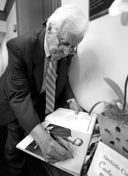 Bill Dufford signs a copy of the 1961 Beaufortonian yearbook at the Newberry - photo 2