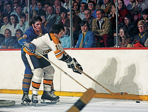 My brother Norm playing for the Sabres tries to go around Carol Vadnais of - photo 11