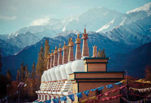 Prayer flags strung near a Buddhist shrine in Ladakh in the Indian Himalayas - photo 3