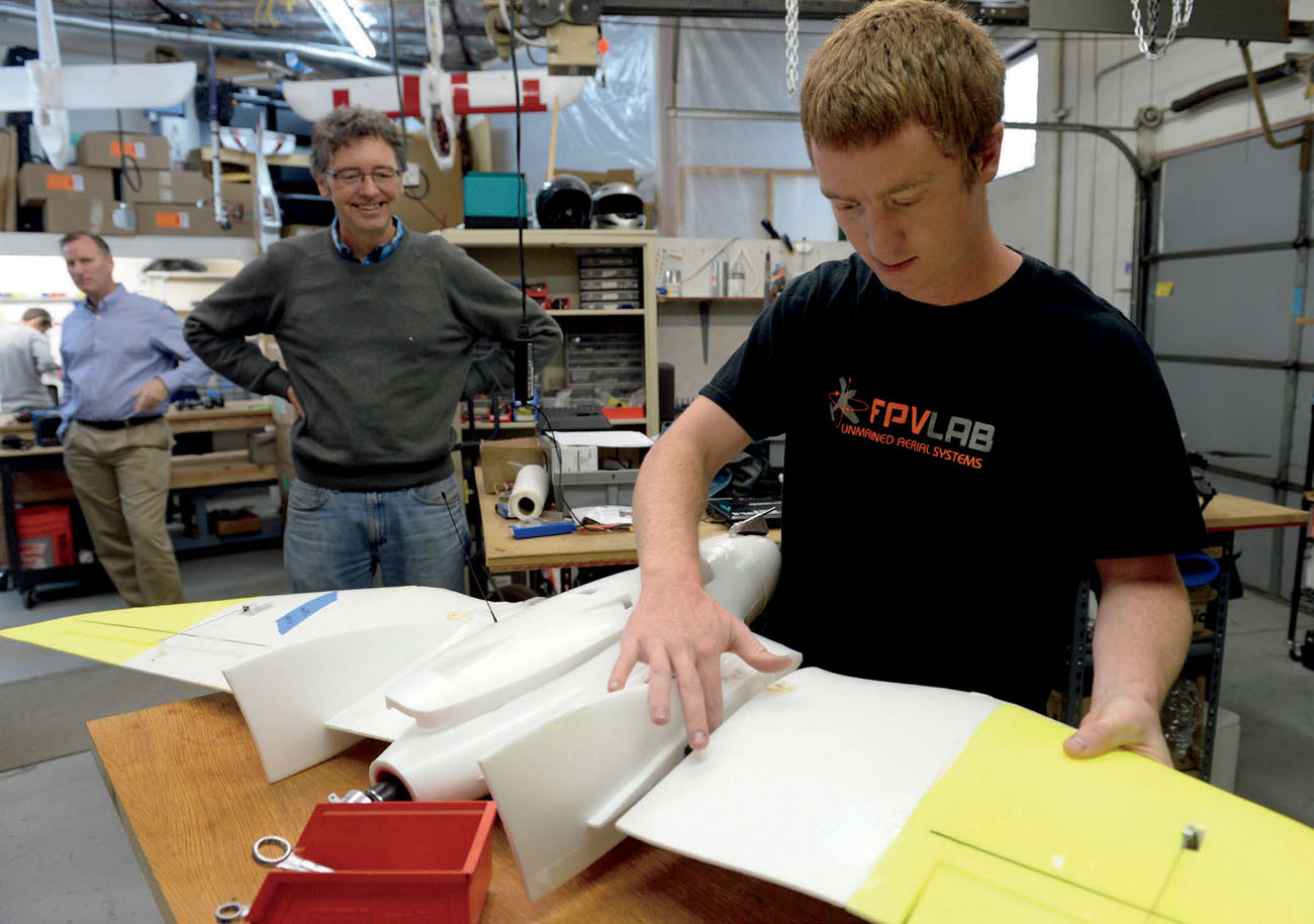 A technician assembles a fixed-wing drone at agricultural drone manufacturer - photo 9